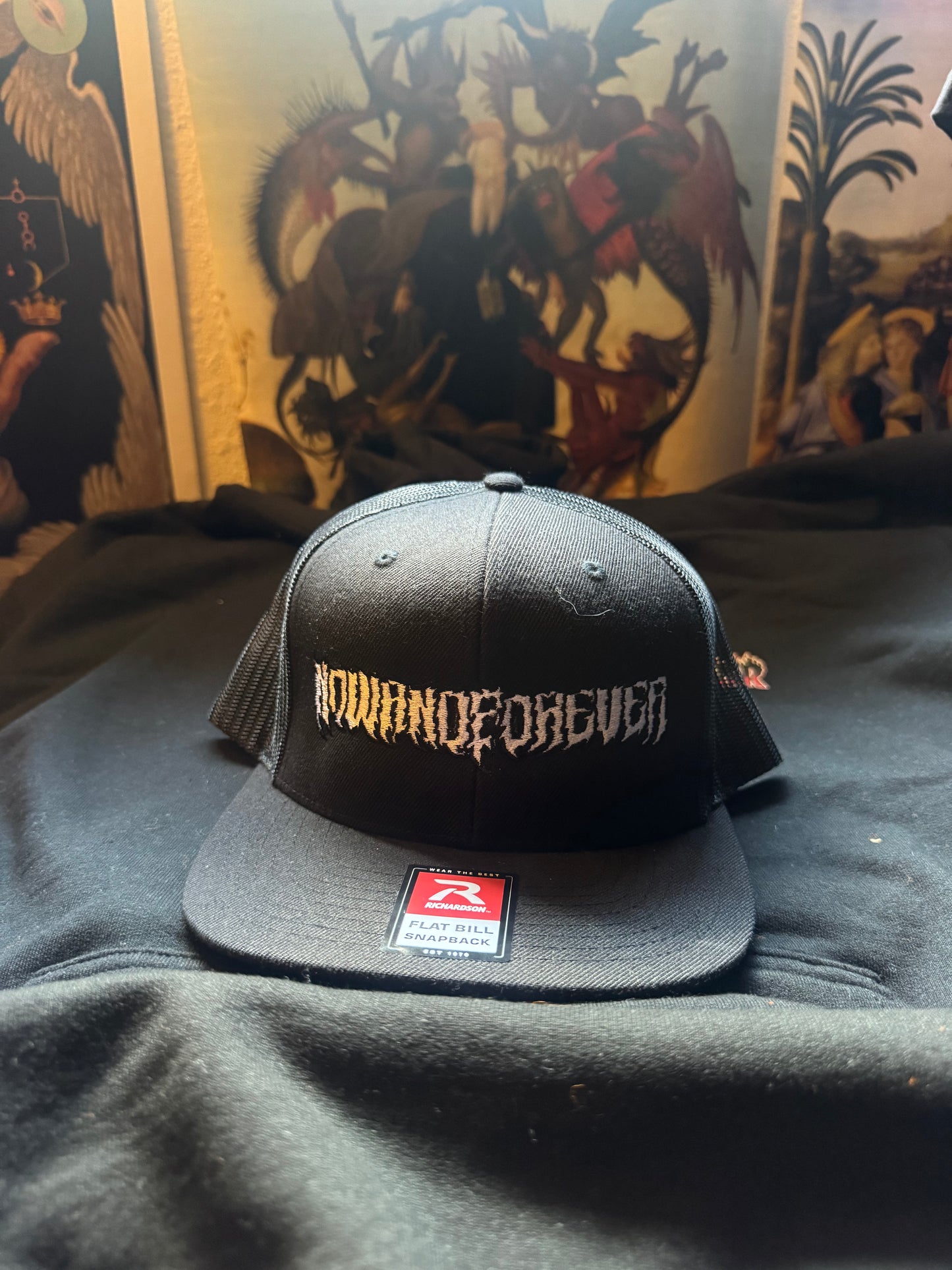 Graffiti wordmark trucker cap, alternate view showing the mesh back panel and snapback closure