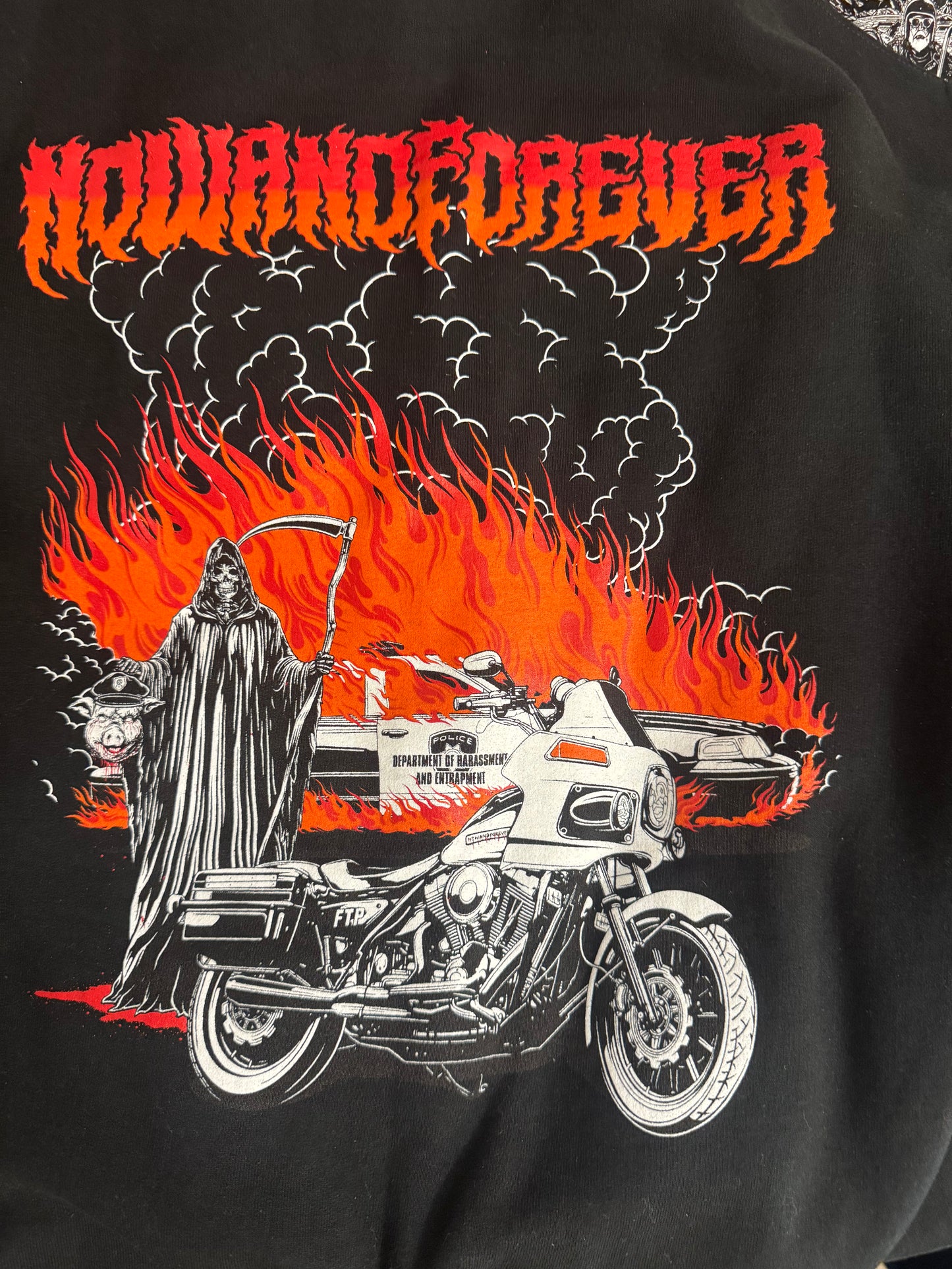 Burning Pigs crewneck, close detail of the flame and smoke work behind the reaper