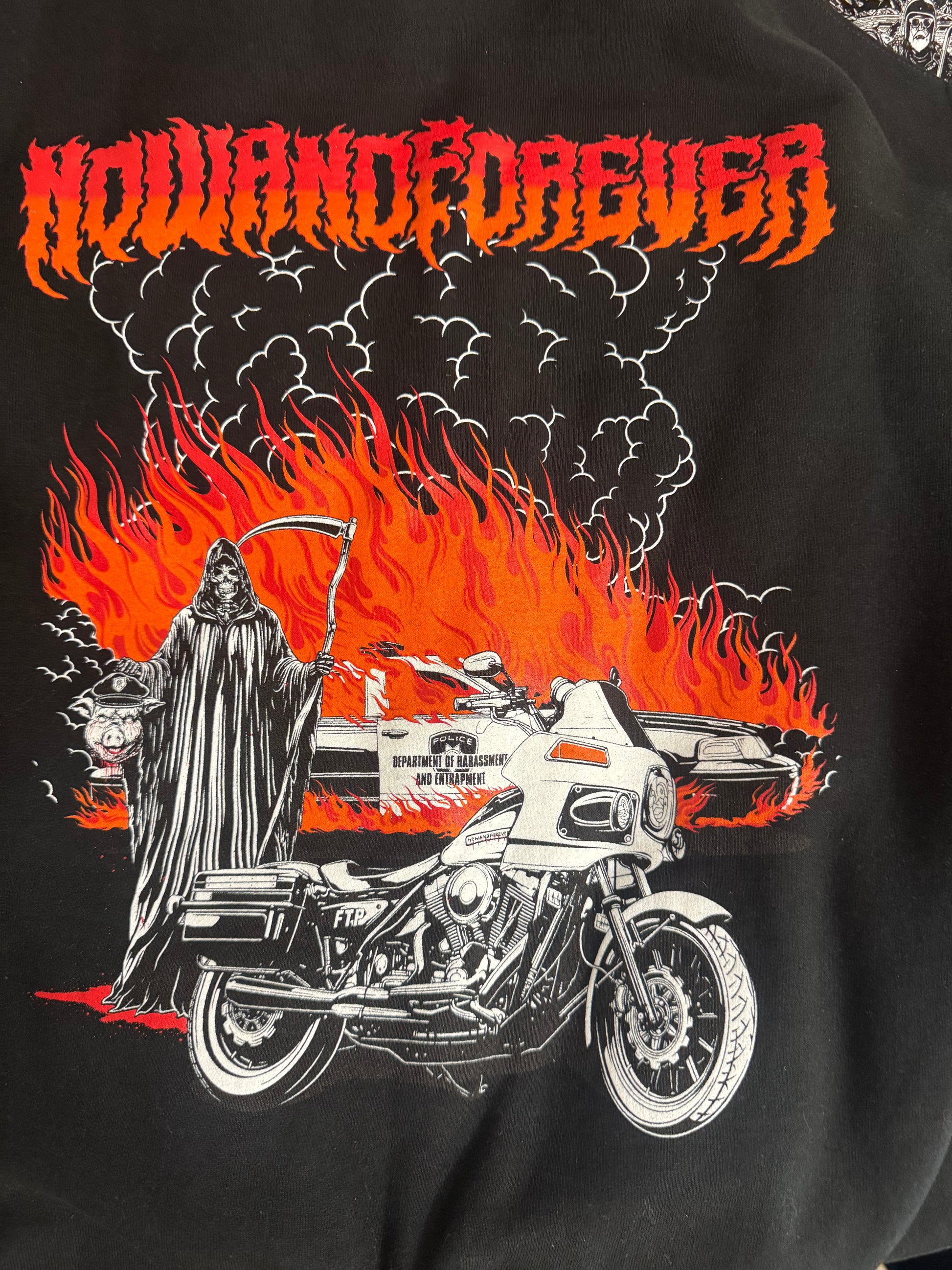 Burning Pigs crewneck, close detail of the flame and smoke work behind the reaper